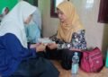 Penyuluh KUA Cisolok Jadi Relawan Guru Ngaji, Dampingi Siswa SMPN 1 Cisolok Berantas Buta Huruf Al-Qur’an